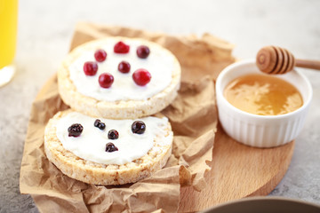 Whole grain bread with cottage cheese and berries, closeup. Useful and quick snack. Healthy breakfast.