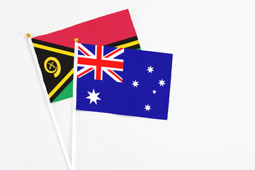 Australia and Vanuatu stick flags on white background. High quality fabric, miniature national flag. Peaceful global concept.White floor for copy space.