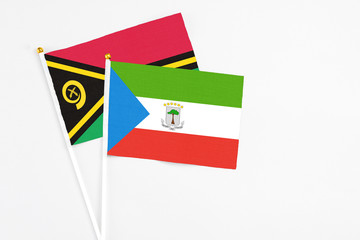 Equatorial Guinea and Vanuatu stick flags on white background. High quality fabric, miniature...