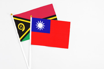 Taiwan and Vanuatu stick flags on white background. High quality fabric, miniature national flag. Peaceful global concept.White floor for copy space.