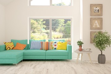 Stylish room in white color with sofa and summer landscape in window. Scandinavian interior design. 3D illustration