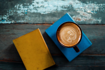 Naklejka premium Relaxation Concept. Relaxing by Reading Book and Coffee in Cozy Place or Cafe, Top View, Selective Focus