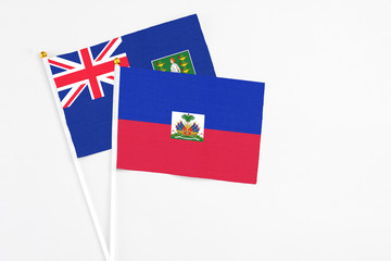 Haiti and British Virgin Islands stick flags on white background. High quality fabric, miniature...