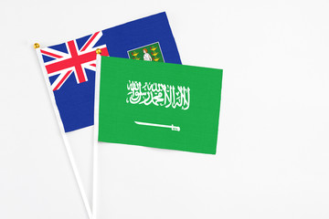 Saudi Arabia and British Virgin Islands stick flags on white background. High quality fabric, miniature national flag. Peaceful global concept.White floor for copy space.