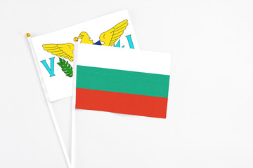 Bulgaria and United States Virgin Islands stick flags on white background. High quality fabric, miniature national flag. Peaceful global concept.White floor for copy space.