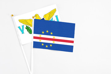 Cape Verde and United States Virgin Islands stick flags on white background. High quality fabric, miniature national flag. Peaceful global concept.White floor for copy space.