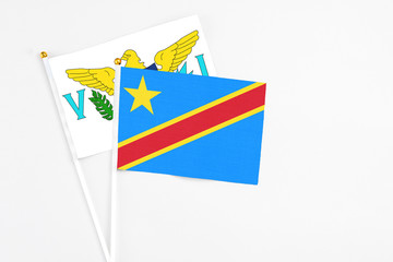Congo and United States Virgin Islands stick flags on white background. High quality fabric, miniature national flag. Peaceful global concept.White floor for copy space.