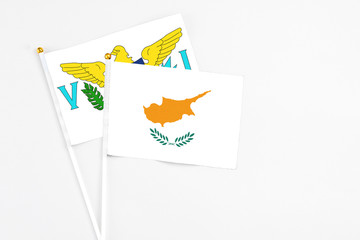 Cyprus and United States Virgin Islands stick flags on white background. High quality fabric, miniature national flag. Peaceful global concept.White floor for copy space.