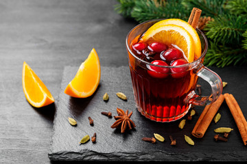 Christmas mulled wine or gluhwein with spices and orange slices.