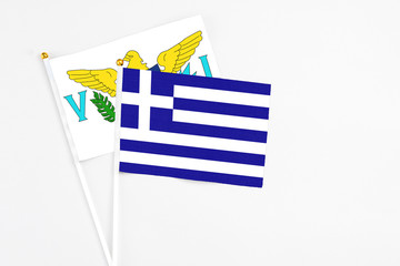 Greece and United States Virgin Islands stick flags on white background. High quality fabric, miniature national flag. Peaceful global concept.White floor for copy space.