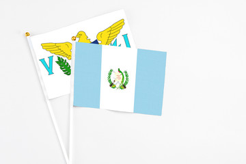 Guatemala and United States Virgin Islands stick flags on white background. High quality fabric, miniature national flag. Peaceful global concept.White floor for copy space.
