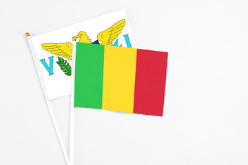 Mali and United States Virgin Islands stick flags on white background. High quality fabric, miniature national flag. Peaceful global concept.White floor for copy space.