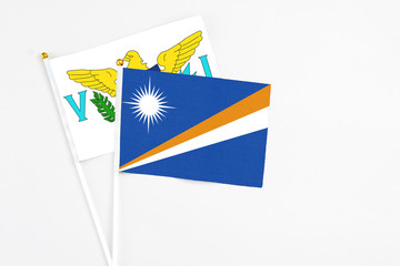 Marshall Islands and United States Virgin Islands stick flags on white background. High quality...