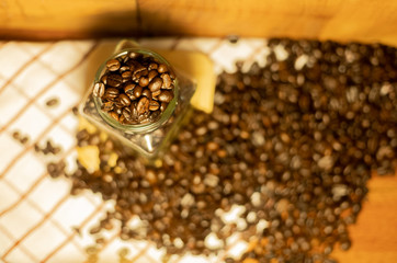 Coffee beans resting on a brown wooden table
