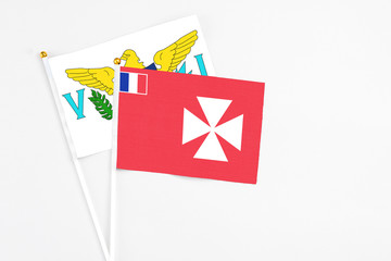 Wallis And Futuna and United States Virgin Islands stick flags on white background. High quality fabric, miniature national flag. Peaceful global concept.White floor for copy space.