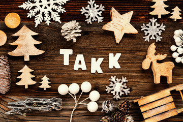 Letters Building The Word Takk Means Thank You. Wooden Christmas Decoration Like Tree, Sled And Star. Brown Wooden Background