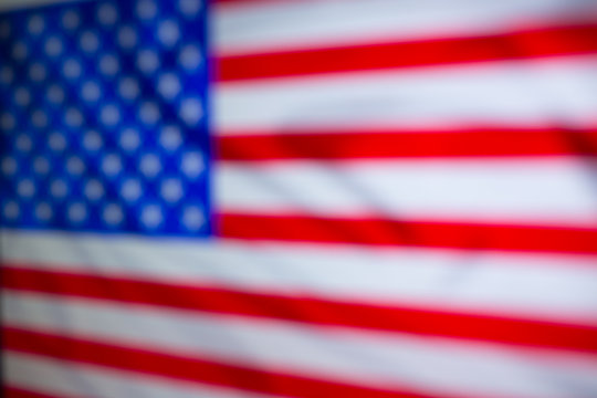 Blurred US flag close up. Developing in the wind.