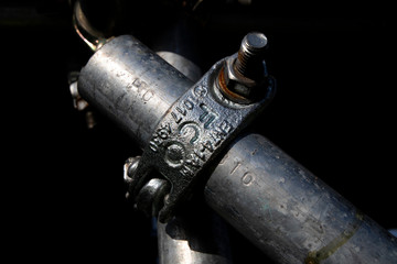 Galvanised steel scaffolding coupling connection on construction site 