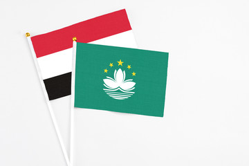 Macao and Yemen stick flags on white background. High quality fabric, miniature national flag. Peaceful global concept.White floor for copy space.