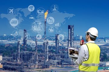 Double exposure of engineers holding walkie talkie are working orders the oil and gas refinery plant and offshore drilling. Industry petrochamical concept image.