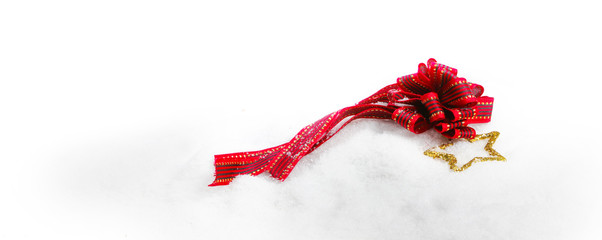 Christmas ribbon with a star in snow