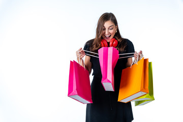 Cheerful happy woman enjoying shopping with white background