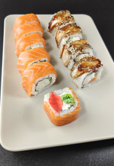 Various kinds of sushi food served on plate.