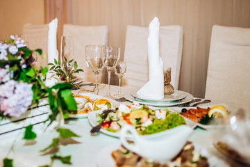 Wedding table setting. Glass, plate, fork, knife