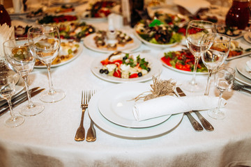 Wedding table setting. Glass, plate, fork, knife