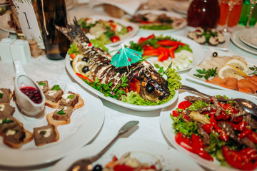 Stuffed fish decorated with a decorative umbrella