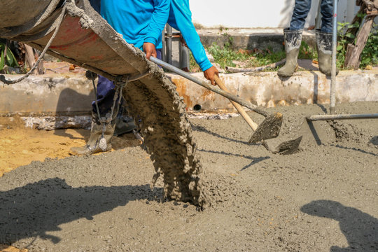 Worker or labor or workforce working or build construction road by concrete ready mixed