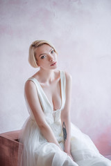 Modern beauty fashion bride. Bride with short blond hair. The bold image of the bride.