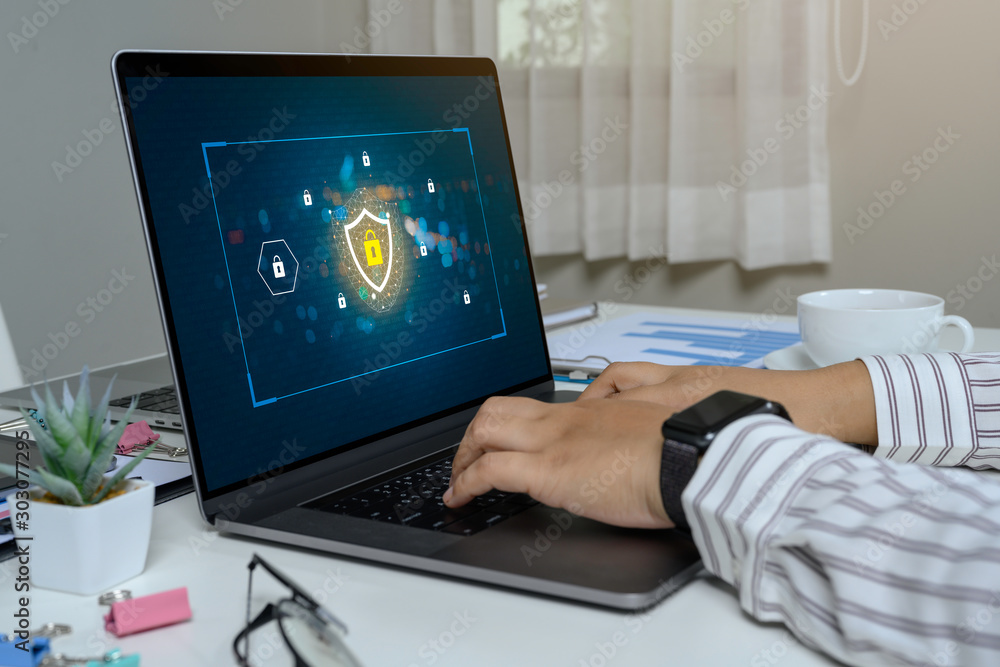 Poster person using a laptop computer with data protection, cyber security, information safety and encrypti