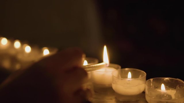 Lighting A Candle In A Catholic Church In Italy Slow Motion