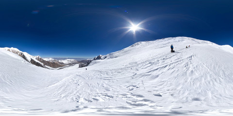 Spherical panorama of the Pamir mountain. Slope of Lenin Peak to an altitude of 5000 meters. Spherical panorama 360 degrees 180 Mountain hiker to climb a mountain of snow couloir.