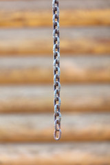 A metal chain hangs in the room