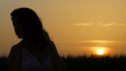 Silhouette of a Woman Against a Sunset