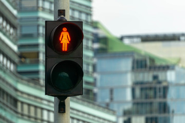 Red pedestrian signal. Traffic light female figure shape in one of avenue in Vilnius, Lithuania