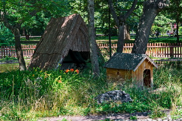 Fototapeta na wymiar A small house built into the lake with nesting place for ducks in the city garden, Sofia, Bulgaria 