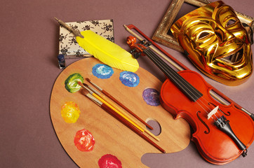 Naklejka premium Attributes of the arts. Music, theater, literature, painting. Violin, theater mask, fountain pen, art palette.