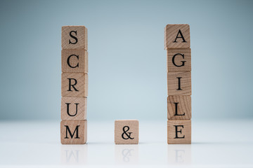 Wooden Scrum And Agile Blocks On Blue Background