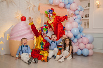 Obraz na płótnie Canvas Clowns from the circus on the birthday of a child. Party for children.