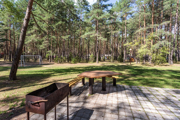 wooden camping arbors  with all conviniences in a pine forest