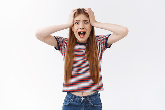 Freak-out, Shocked Girl In Stupor, Panicking, Grab Head With Both Hands, Screaming And Cringe Face Horrified, Standing Distressed And Scared, Cannot Control Emotions Think Straight, White Background