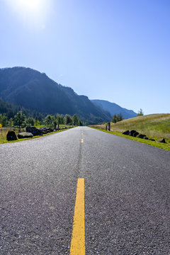 Marked road in Columbia Gorge with Mountains and Trees