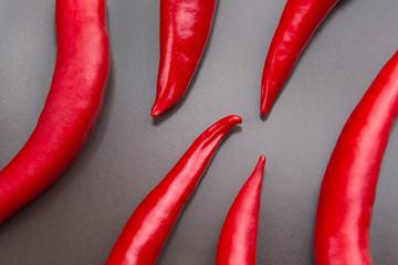 Red hot pepper close-up on gray background. Healthy food and vitamins