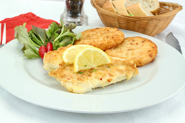 Millet fish fillet and roasted on a plate