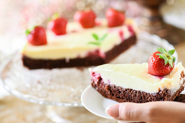 Fresh tart piece with forest fruits like strawberries on top and vanilla cream..Finest cake or dessert selective focus.
