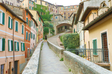 Fototapeta na wymiar Perugia, Italy. Old medieval aqueduct and colorful buildings.
