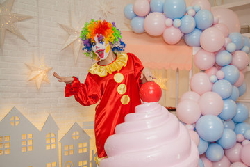 Merry circus clowness and a huge cake